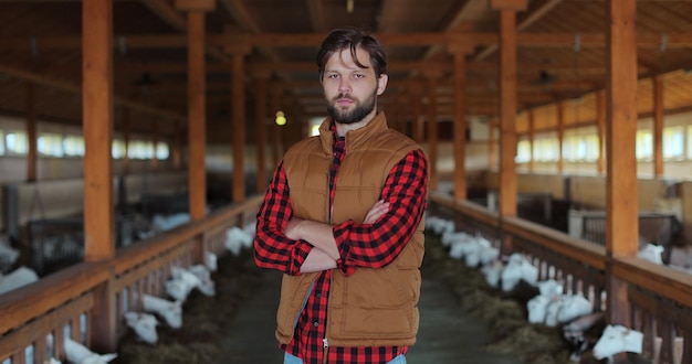 portrait young farmer owner looking camera background goats farm organic husbandry production concept modern livestock farming business 299057 1748